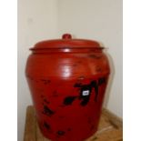 AN ORIENTAL RED LACQUERED LARGE VASE AND COVER.