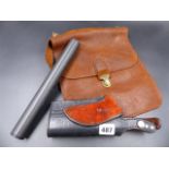 AN AIR RIFLE SILENCER, A LEATHER BELT HOLSTER AND A SMALL LEATHER BAG.