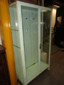 A VINTAGE MID CENTURY STEEL FRAMED GLAZED MEDICAL CABINET WITH SHELVED INTERIOR. 100 x 46 x H.