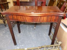 AN 18th.C.MAHOGANY FOLD OVER CARD TABLE OF SERPENTINE OUTLINE ON FLUTED SQUARE SECTION LEGS. W.86