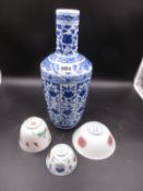 A CHINESE BLUE AND WHITE VASE, SEAL MARK UNDERFOOT, H.31.5cms, A FAMILLE ROSE TEA BOWL PAINTED