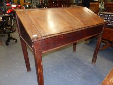 AN ANTIQUE MAHOGANY AND PINE DOUBLE CLERK'S DESK WITH TWIN RISING TOPS, PIGEON HOLED INTERIOR AND