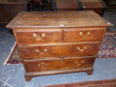 AN 18th.C.OAK SMALL CHEST OF TWO SHORT AND TWO LONG GRADUATED DRAWERS ON BRACKET FEET. 92 x 45 x H.