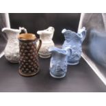 FOUR MID 19th.C. MOULDED POTTERY JUGS AND ANOTHER BY DOULTON, THE JUG, H.22.5cms. THE DOULTON WITH