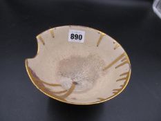 A STUDIO PORCELAIN BOWL, THE RIM OF THE ROUNDED CONICAL SHAPE INDENTED TO ONE SIDE AND DRIPPED
