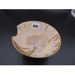 A STUDIO PORCELAIN BOWL, THE RIM OF THE ROUNDED CONICAL SHAPE INDENTED TO ONE SIDE AND DRIPPED