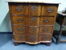 AN 18th.C.CONTINENTAL WALNUT AND CROSSBANDED SHAPED FRONT CHEST OF FOUR GRADUATED DRAWERS ON BRACKET
