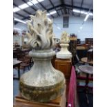 A PAIR OF WEATHERED POTTERY GARDEN / GATE FLAME FORM FINIALS. H.78cms.