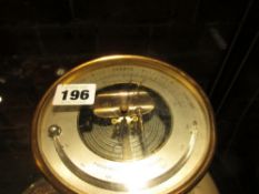 A LATE VICTORIAN HOLOSTERIC ANEROID BAROMETER IN GILT BRASS CASE.