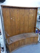 AN ANTIQUE COUNTRY MADE PINE HIGHBACK SETTEE OF CURVED FORM. W.190 x H.171cms.