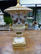 A FRENCH OLD PARIS FLORAL AND GILT DECORATED TWIN HANDLED CAMPAGNA URN NOW MOUNTED AS A LAMP. URN