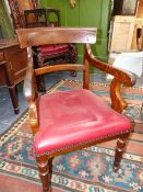 A PAIR OF VICTORIAN DESK ARMCHAIRS WITH DEEP OVERSTUFFED PAD SEATS, EACH WITH CROWNED C.C.MONOGRAM.