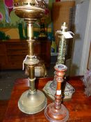 A VICTORIAN BRASS GOTHIC REVIVAL LAMP BASE. OVERALL H.43cms TOGETHER WITH AN ALTAR STICK AND A TREEN