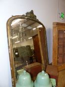 A VICTORIAN GILT FRAMED OVERMANTLE MIRROR WITH GESSO MOULDINGS AND CREST. W.130 x H.145cms.