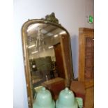 A VICTORIAN GILT FRAMED OVERMANTLE MIRROR WITH GESSO MOULDINGS AND CREST. W.130 x H.145cms.