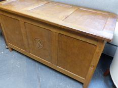 ALAN GRAINGER. ACORNMAN. AN OAK COFFER WITH ADZE PANEL TOP OVER CONFORMING SIDES AND FRONT AND