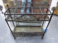 AN ANTIQUE WROUGHT IRON ARTS AND CRAFTS STYLE STICKSTAND WITH COPPER DRIP TRAY. W.66 x H.79cms.