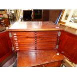 A VICTORIAN MAHOGANY COIN COLLECTOR'S CABINET WITH PANEL DOORS ENCLOSING NINE COIN SLIDES. 49 x 34 x