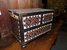 AN INLAID EARLY CONTINENTAL BAROQUE STYLE THREE DRAWER TABLE CABINET WITH OVERALL GEOMETRIC