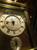 A FRENCH GORGE CASED ALARM CARRIAGE CLOCK, THE REPEAT BUTTON ABOVE CIRCULAR SILVERED DIALS, THE