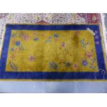 AN ANTIQUE CHINESE RUG. 219 x 120cms.