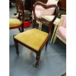 A SET OF SIX EARLY VICTORIAN ROSEWOOD BALLOON BACK DINING CHAIRS WITH CARVED RAIL BACKS, DROP IN