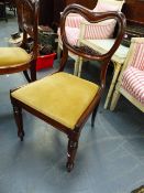 A SET OF SIX EARLY VICTORIAN ROSEWOOD BALLOON BACK DINING CHAIRS WITH CARVED RAIL BACKS, DROP IN