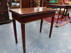 A LATE GEORGIAN MAHOGANY FOLD OVER TEA TABLE ON SQUARE TAPER LEGS. W.87cms.