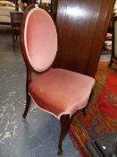 A PAIR OF ANTIQUE CARVED MAHOGANY FRENCH HEPPLEWHITE STYLE SALON CHAIRS WITH OVAL BACKS AND SCROLL