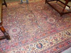 AN ANTIQUE PERSIAN CARPET OF CLASSIC DESIGN. 312 x 414cms.