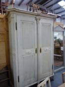 AN IMPRESSIVE PAINTED PINE NORTH EUROPEAN CARVED NEO-CLASSIC STYLE TWO DOOR ARMOIRE. W.180 x D.60