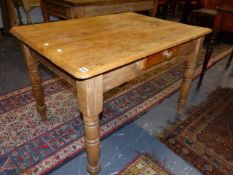 A LATE VICTORIAN PINE KITCHEN TABLE ON TURNED LEGS. 106 x 76 x H.74cms.