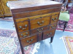 A LATE GEORGIAN MAHOGANY BATCHELOR'S DRESSING CABINET WITH RISING TOP ENCLOSING FITTED COMPARTMENTS.