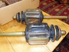 A PAIR OF ANTIQUE TOLEWARE AND BRASS CARRIAGE LAMPS WITH BEVELLED GLASS LENSES. H.67cms.
