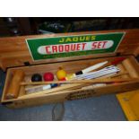 A JAQUES / ELMER COTTON PINE CASED CROQUET SET.