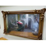 AN EARLY VICTORIAN GILT FRAMED OVERMANTLE MIRROR WITH ACANTHUS LEAF DECORATION. 130 x 80cms.