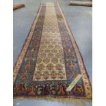 AN ANTIQUE PERSIAN TRIBAL RUNNER. 562 x 110cms.