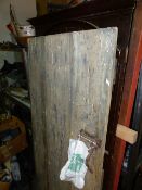 AN EARLY ELM BOARDED RUSTIC DOOR. 182 x 92cms.