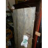 AN EARLY ELM BOARDED RUSTIC DOOR. 182 x 92cms.