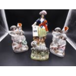 TWO STAFFORDSHIRE POTTERY FLAT BACK SPILL VASES, H.18.5cms A FIGURE OF A SHEPHERDESS, H.27cms AND