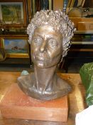 20th.C. SCHOOL A BRONZE BUST ON A WOODEN PLINTH BASE, INITIALLED A.D.W. H.47cms.