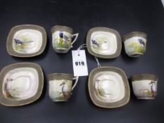 A SET OF FOUR ROYAL WORCESTER COFFEE CUPS AND SAUCERS, DATE CODE FOR 1911/12 EACH PAINTED BY