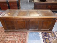 AN 18th.C.AND LATER OAK COFFER WITH FOUR PANEL TOP OVER FOUR PANEL FRONT AND PLINTH BASE. 154 x 54 x