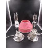 A PAIR OF SILVER HALLMARKED ELECTRIC TABLE LAMP BASES INCLUDING SHADES WITH HEXAGONAL LOADED