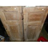 TWO PAIRS OF ANTIQUE PINE PANELLED CUPBOARD DOORS OF DIFFERING DESIGN.