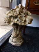 A PAIR OF WEATHERED CARVED STONE CORNUCOPIA FORM FINIALS WITH FLOWER HEAD TOPS. H.50cms.