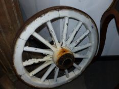 A PAIR OF ANTIQUE IRON BOUND WOODEN CART WHEELS. Dia.69cms.
