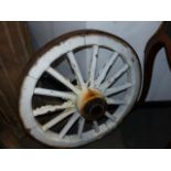 A PAIR OF ANTIQUE IRON BOUND WOODEN CART WHEELS. Dia.69cms.