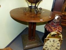 A CONTINENTAL ARTS AND CRAFTS STYLE CIRCULAR CENTRE TABLE ON CLUSTER COLUMN SUPPORTS AND STUDDED