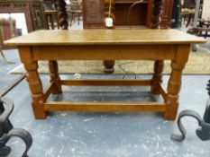 ROBERT THOMPSON, MOUSEMAN. A RECTANGULAR COFFEE TABLE WITH ADZE CUT WORK TOP, SHAPED OCTAGONAL